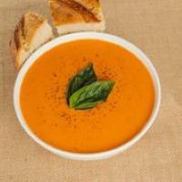 Organic Tomato Bisque · A luscious, silky, Organic tomato and sweet cream soup. Served with sourdough bread. Vegetarian and gluten-free.
