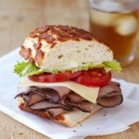 Roast Beef and Sharp Cheddar Sandwich · All-natural roast beef, sharp cheddar cheese, green leaf lettuce, tomato, mayo and Dijon on ...