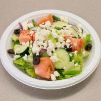 Greek Salad · Lettuce, tomatoes, cucumber, black olives, onions, feta cheese and Greek dressing.