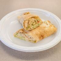 Shawarma Wrap · Grilled chicken or beef, lettuce, tomatoes, pickles, onions and garlic sauce.