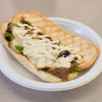 Philly Cheese Steak · Grilled steak, mushrooms, onions, green peppers and Swiss cheese.