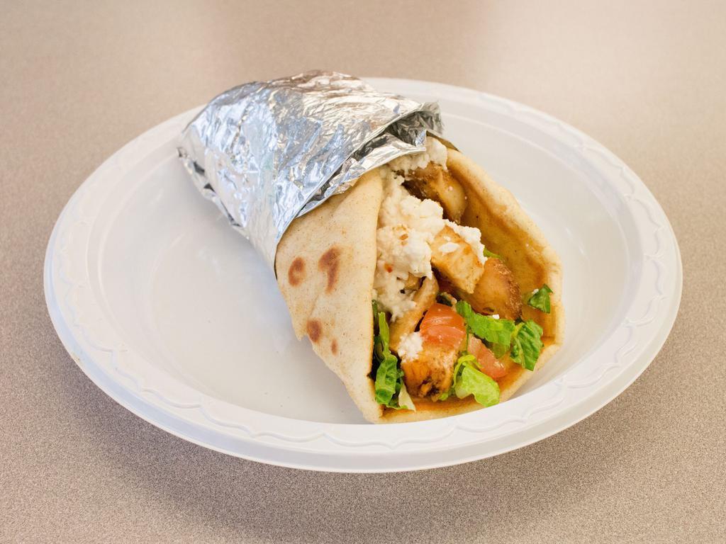 Chicken Greek Pita · Grilled chicken, lettuce, tomatoes, feta cheese and Greek sauce on a Greek pita.