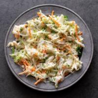 Picnic Slaw · Mix of cabbage, parsley, shredded carrots tossed in a creamy slaw dressing