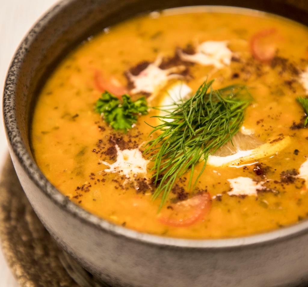 Lentil Soup · Red lentils, carrots, garlic, onions, herbs, Moroccan spices, olive oil. Served with pita bread.