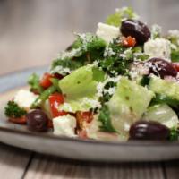 Greek Salad · Romain hearts, onions, tomato, cucumbers, feta cheese, house dressing.