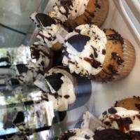 Oreo Cookies and Creme Cupcake · Vanilla cake with crushed Oreo cookies folded into batter. Topped with Oreo buttercream and ...