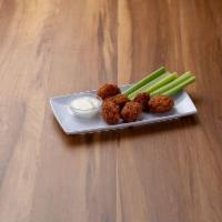 Boneless Wings · Cooked wing of a chicken coated in sauce or seasoning.