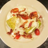 WEDGE SALAD   *gf · Half of a Iceberg Lettuce Head Topped with Cherry Tomatoes, Blue Cheese Crumbles, Smoked Bac...