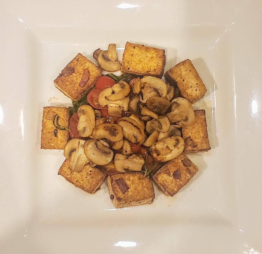 GRILLED TOFU   *gf v · On a bed of Sautéed Mixed Greens, Mushrooms,  Cherry Tomatoes, Garlic, Rosemary, White Wine and our Balsamic reduction sauce