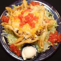 Taco Salad · A crisp tortilla shell filled with specially seasoned choice of meat, lettuce,
tomatoes, bla...