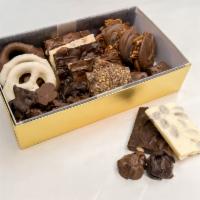 2 lb. Sampler Box · Mix of toodles, toffee, assorted almond bark, fudge balls, nut and raisin clusters, chocolat...