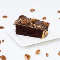 Chocolate Turtle · Delectable chocolate cake topped with Coco's celebrated caramel icing, pecans & chocolate dr...