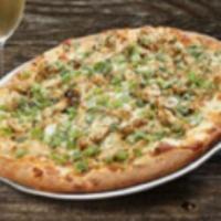 Gluten Free Kickin' Chicken Pizza · Chicken marinated in a spicy ginger Thai sauce with peanuts, green onions, Swiss, fontina, f...