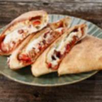 Big Wednesday Calzone · Mozzarella, ricotta, garlic, caramelized onions, Italian sausage, roasted red peppers, peppe...