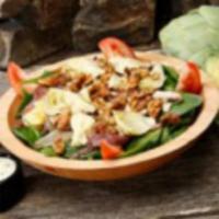Spinach Salad · Spinach, fresh mushrooms, caramelized onions, vine ripe tomatoes, artichoke hearts and candi...