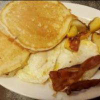 Breakfast Bonanza · 2 eggs, 2 pancakes and homefries, with bacon, ham or sausage.