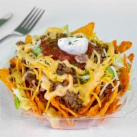 Nacho Salad · Chips, queso, ground beef. lettuce, and salsa.