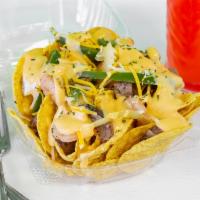Premium Surf & Turf · Steak,shrimp, peppers and onions, shredded cheese,house queso