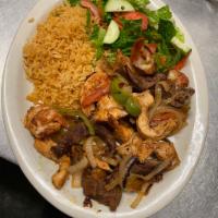 Fajitas Mixtas · Grilled steak, chicken, shrimp and chorizo grilled and served sizzling with bell peppers, on...