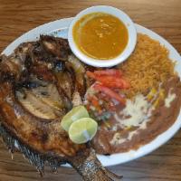 Mojarra a la Plancha · With fries and salad. Served with rice, beans, and flour or corn tortillas.