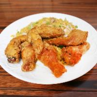 4. Chicken Wings · 6 piece. Cooked wing of a chicken coated in sauce or seasoning.
