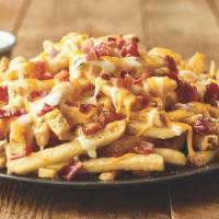 Aussie Cheese Fries  · Topped with melted Monterey Jack and Cheddar cheeses and chopped bacon, with house-made ranc...
