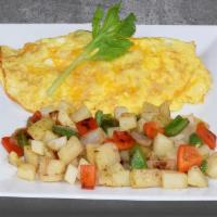 SPINACH AND MUSHROOM OMELETTE · Spinach, mushroom, served with white toast. Choice of home potatoes or hash browns.