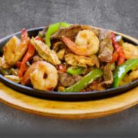 FAJITAS MIXTAS · Grilled Steak, Chicken, Shrimp, cooked with grilled veggies: green pepper, Tomato, and onion...