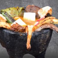 MOLCAJETE DE ASADA, POLLO Y CAMARON · Grilled Steak, Chicken and Shrimp, served in a house sauce, grilled nopal, Chorizo, melted c...