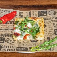 Spinach & Roasted Red Pepper Pizza · spinach, roasted red pepper, white sauce, and arugula