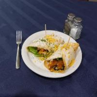 Buffalo Chicken Wrap · Breaded chicken, cheese, lettuce, tomato, black olives and sour cream wrapped in flour torti...