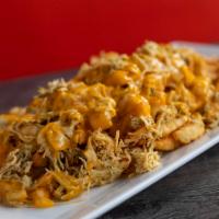 Chicken Supreme Fries · French fries loaded with delicious melted cheese over shredded chicken topped with our delic...