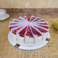 Limoncello Raspberry Cake · Layers of limoncello soaked sponge cake filled with lemon cream and raspberry marmalade, dec...