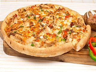 Santa Fe Chicken Pizza · Homemade chipotle ranch sauce and loaded with juicy chicken strips, sautéed green and red peppers, onions, smoked bacon, melty cheddar, our signature gourmet cheese blend, and a sprinkle of sharp Parmesan cheese. Spicy.