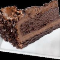 Chocolate Mousse Cake · Layers of rich chocolate cake and fluffy chocolate mousse, topped with chocolate shavings. 