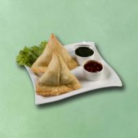 Village Veggie Turnovers (Vegan) · Crispy fried pastry with a savory filling 