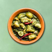 Potato Spinach Supreme (Vegan) · Diced potatoes slow cooked till soft in a thick ginger, garlic spinach gravy.