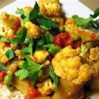 Aloo Gobi  · North Indian traditional cauliflower and potato dish cooked with garlic, onion, turmeric and...