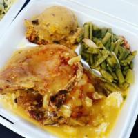 Smothered Fried Pork Chops Over Rice Platter · Fried porkchops served over a bed of rice and smothered with our homemade gravy. Served with...