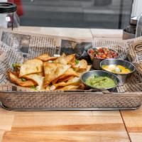 Trio Dippers · Tortilla chips with house-made guacamole, pico de gallo, and queso.