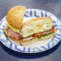 4. Le Midi Bagel  · Turkey bacon, Swiss cheese, eggs, spinach, tomato, and onion.
