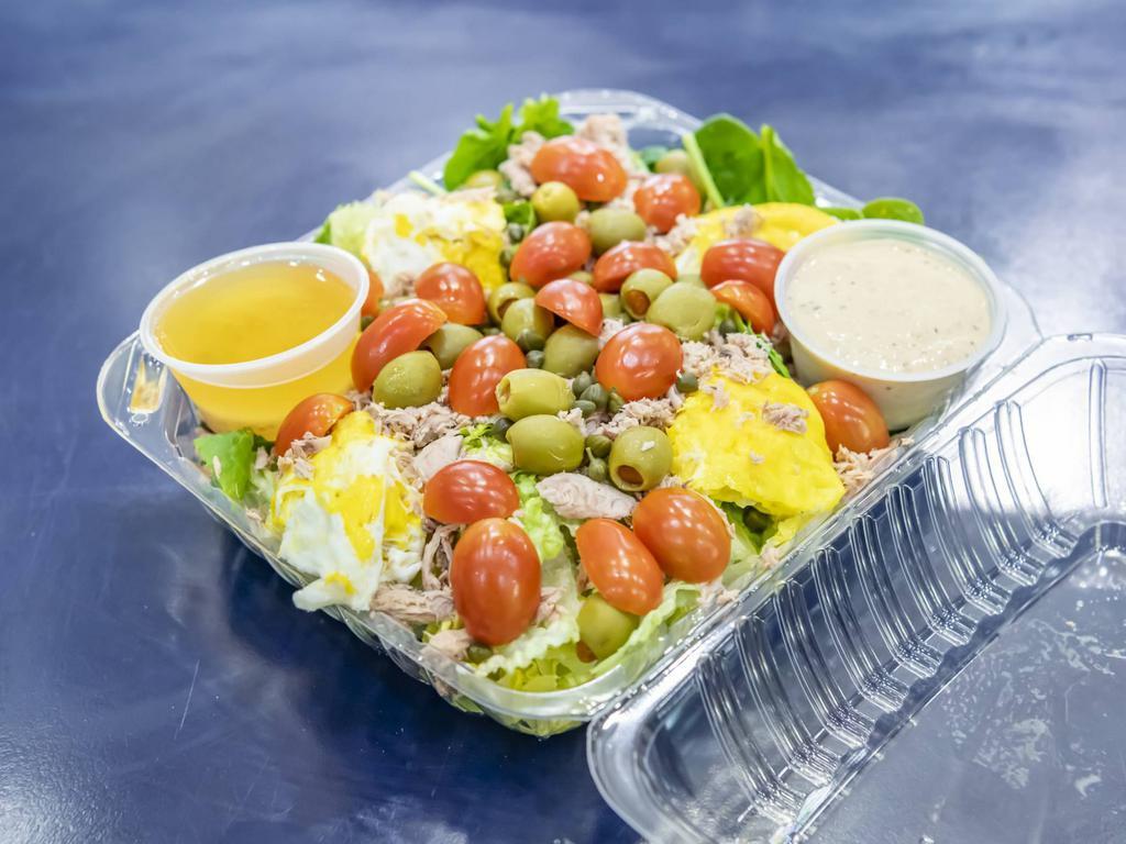 Nicoise Salad · Romaine, spinach, tuna, eggs, tomato, olives, and capers.
