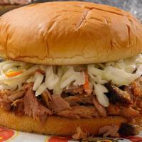 Smothered Pork Sandwich · Chopped BBQ pork covered with coleslaw on a toasted bun.