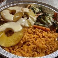 Pollo Hawaii  · Grilled chicken breast on top cheese sauce and pineapple. Served with rice, broccoli, caulif...