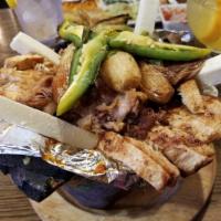Molcajete carnes · Grilled chicken, steak, shrimp, Mexican sausage, onions, bell peppers, with special sauces, ...