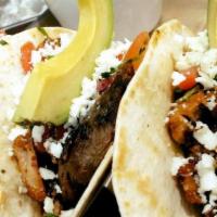 Tacos · Served with rice or beans or fries. 3 tacos corn or flour topped with onion, cilantro and yo...