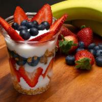 Yogurt Parfait Cup · Low fat vanilla yogurt, organic honey oats granola, fresh blueberries and strawberries.