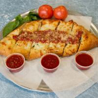 Meat Lover Calzone · Load of pepperoni, ham, Italian sausage, meatballs, salami and sauce topped with mozzarella ...