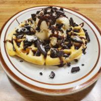 The Oreo · Waffle stuffed with crushed Oreos, topped with vanilla ice cream, Oreos, chocolate drizzle a...