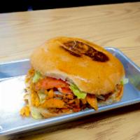 Torta · A toasted Mexican sandwich served with your choice of meat, beans, lettuce, tomato, cheese, ...